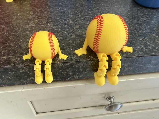 Softball large and small side by side